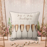 Wedding Gift Row of Pink Champagne Glasses Cushion<br><div class="desc">This stunning wedding pillow features a row of elegant champagne glasses,  perfect for celebrating the newlywed couple. Personalise it with the couple's name in beautiful script for a truly unique touch. A thoughtful bridal shower or wedding gift that will be cherished for years to come.</div>