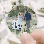 Wedding Photo & Elegant Black Script Thank You Classic Round Sticker<br><div class="desc">Add an elegant personalised touch to wedding thank you cards and reception party favours with these custom photo round stickers / envelope seals. Picture, couple's names, date and heart are all simple to customise. (IMAGE PLACEMENT TIP: An easy way to centre a photo exactly how you want is to crop...</div>