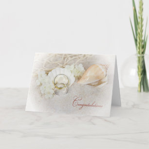 Wedding rings in seashell card