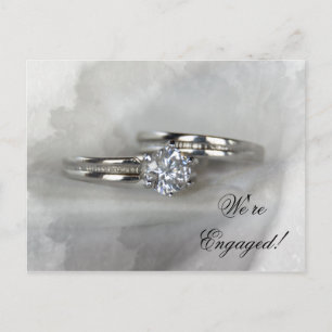 Wedding Rings on Grey Engagement Announcement