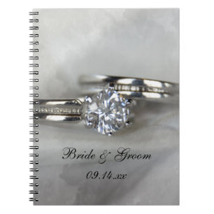 Wedding Rings on Grey Notebook