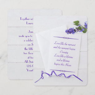 weddingwhite stationery on wood with purple ribbon invitation