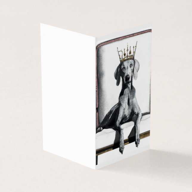 Weimaraner wearing a crown sitting on a chair  (Outside)