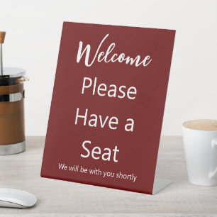 Welcome Please Have a Seat Dark Red and White Text Pedestal Sign