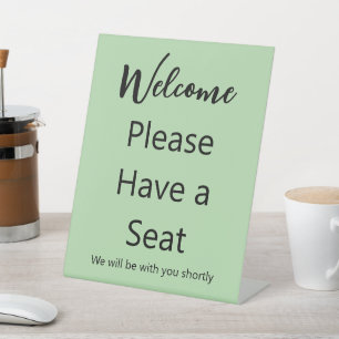 Welcome Please Have a Seat Pale Green & Black Text Pedestal Sign