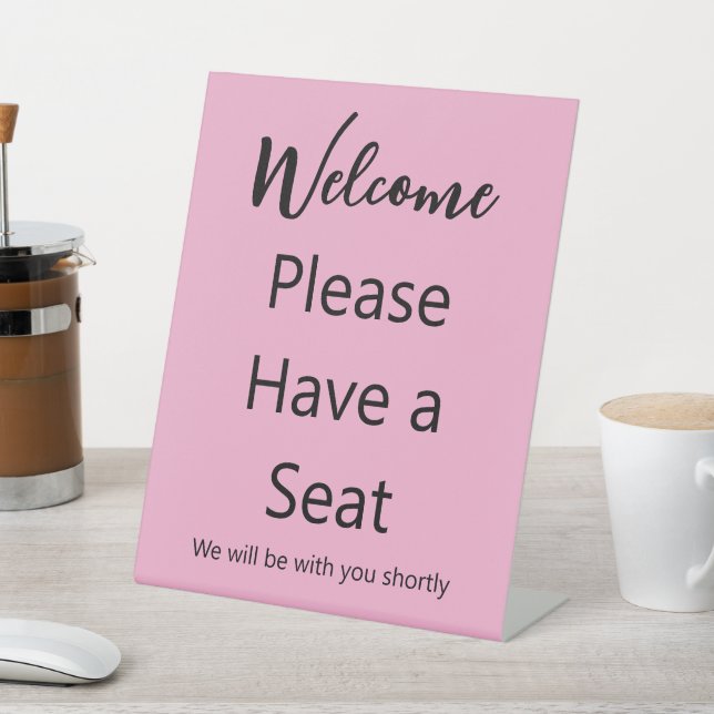 Welcome Please Have a Seat Pink and Black Text Pedestal Sign (In SItu)