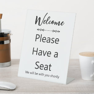 Welcome Please Have a Seat White and Black Pedestal Sign