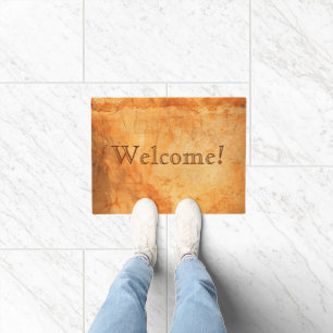 Welcome terracotta coloured brick wall doormat