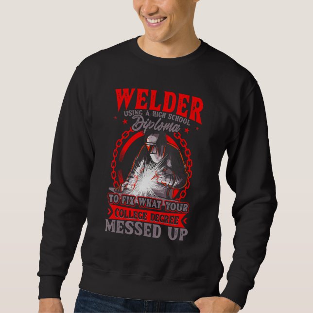 Welder Using A High School Diploma To Fix Sweatshirt (Front)