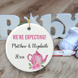 We're Expecting A Baby Girl is Brewing Teapot Ceramic Tree Decoration<br><div class="desc">Pretty ornament for your pregnancy which you can personalise. One side has pink flowers and hand lettered script typography which reads "A baby girl is brewing". The other side has a cute pink teapot and your custom text. The template is set up for you to edit the sample wording which...</div>