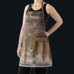 Western Cowboy Boots Rustic Barn Monogram Apron<br><div class="desc">This fun,  rustic apron features two pair of cowboy boots and a log cabin wall with string lights. For the western or horse lover. Wear it in the kitchen or the barn. Created by Simply Farmhouse Press; photo by Melanie Mauer on Unsplash.</div>