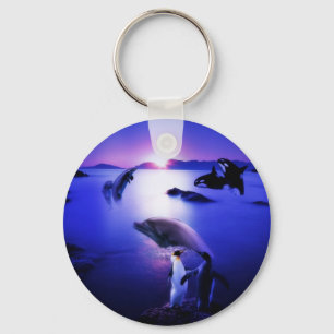 Whales dolphins penguins ocean sunset key ring