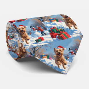 Wheaten Terrier Running in Snow with Christmas Hat Tie