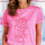 Whimsical coquette bow tying knot bridal shower T-Shirt<br><div class="desc">Whimsical coquette bow tying the knot modern boho elegant stylish handwritten bridal shower party favour decor matching t-shirt design. Contemporary red and pink collection.</div>