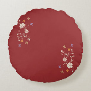 Whimsical Floral and Butterfly Accents on Dark Red Round Cushion