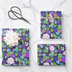 Whimsical green frogs and lily pads on dark blue wrapping paper sheet