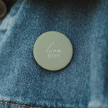 Whimsical Sage Green Gender Reveal Team Boy 6 Cm Round Badge<br><div class="desc">Introducing our whimsical sage green gender reveal team boy button, perfect for your simple modern boho celebration any season of the year! This button has a boho-chic, gender-neutral vibe with elegant calligraphy and a delicate minimalist design, making it ideal for both girls and boys. Plus, it's editable, so you can...</div>