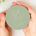Whimsical Sage Green Hello Baby Round Paper Coaster<br><div class="desc">Introducing our whimsical sage green hello baby round paper coaster, perfect for your simple modern boho celebration any season of the year! This coaster has a boho-chic, gender-neutral vibe with elegant calligraphy and a delicate minimalist design, making it ideal for both girls and boys. Plus, it's editable, so you can...</div>