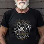 Whiskey Vintage Mens 90th Birthday T-Shirt<br><div class="desc">Celebrate the big 9-0 with style and humour with this vintage whiskey label-inspired birthday design. The black, gold, and white typography is ornate and elegant, giving it a classic retro vintage feel. Perfect for man (or woman!) in your life who loves their scotch, spirits, bourbon, and other liquor drinks. Features...</div>
