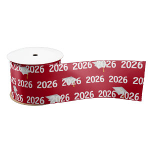 White 2025 Graduation Caps on Red Satin Ribbon