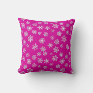 White 3-d snowflakes on a fuchsia pink background cushion