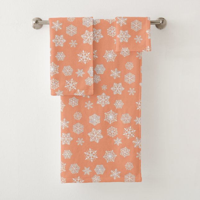 White 3-d snowflakes on a peach background bath towel set (Insitu)
