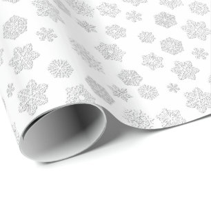 White 3-d snowflakes on a white background wrapping paper