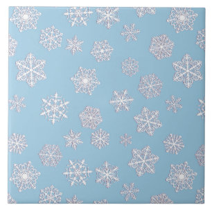 White 3-d snowflakes on an ice blue background tile