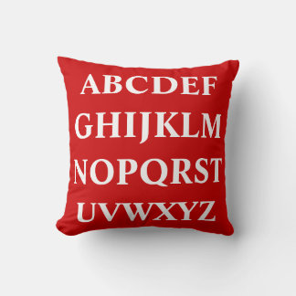 WHITE ALPHABET on red pillow