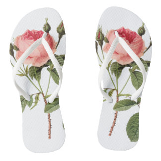 White anchors of a rose on each foot flip flops
