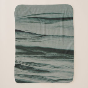 White and black striped textile sherpa blanket
