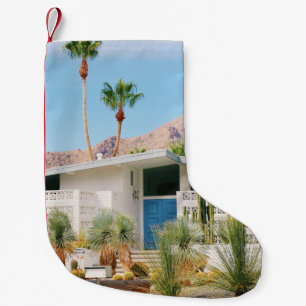 WHITE AND BLUE CONCRETE BUILDING NEAR GREEN TREES SMALL CHRISTMAS STOCKING