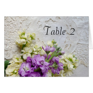 White and purple flowers on old lace