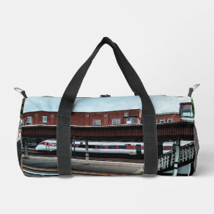 White and red train duffle bag