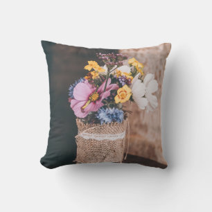 WHITE AND YELLOW PETALED FLOWERS IN GLASS VASE CUSHION