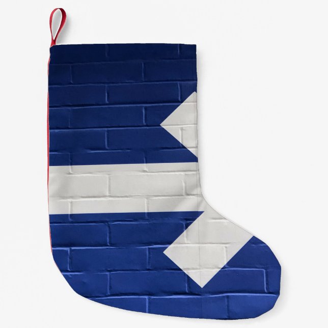 White arrow painted on brick wall small christmas stocking (Front)