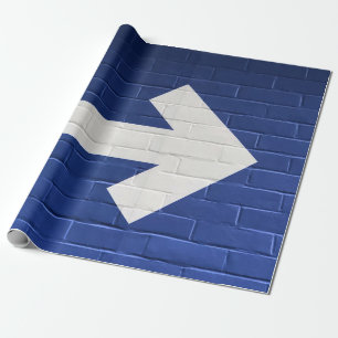 White arrow painted on brick wall wrapping paper