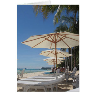 white beach umbrella lounges