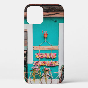 WHITE BICYCLE PARKED BESIDE TEAL PAINTED CONCRETE iPhone 12 CASE