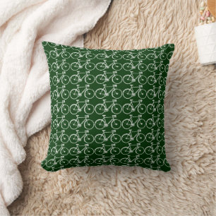 white bicycles on green cushion