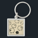 White & Black Sheep on Cream Background Key Ring<br><div class="desc">Is your child having trouble sleeping? Have them count the white and black sheep in this print by Chariklia Zarris. A wonderful piece that is elegant in its simplicity. Order your print today!</div>