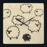 White & Black Sheep on Cream Background Square Wall Clock<br><div class="desc">Is your child having trouble sleeping? Have them count the white and black sheep in this print by Chariklia Zarris. A wonderful piece that is elegant in its simplicity. Order your print today!</div>