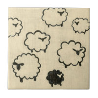 White & Black Sheep on Cream Background