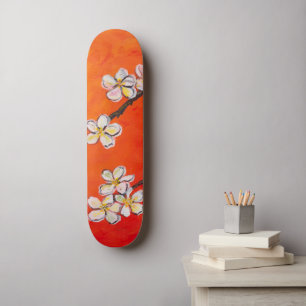White blossoms on orange red spring background  skateboard