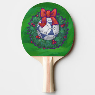 White, Blue Festive Soccer Ball on Green Ping Pong Paddle