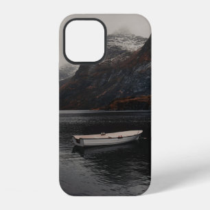 WHITE BOAT ON BODY OF WATER NEAR MOUNTAINS iPhone 12 CASE