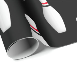 white bowling pins on black wrapping paper