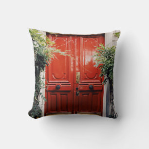 WHITE BUILDING SHOWING CLOSED RED WOODEN DOOR CUSHION