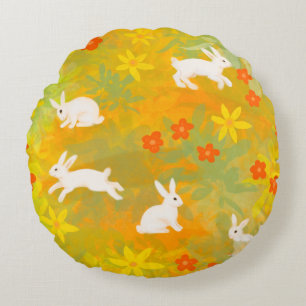 White bunnies on a flower field round cushion
