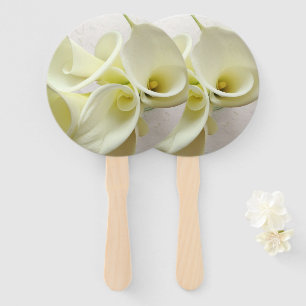 White calla lilies from above hand fan